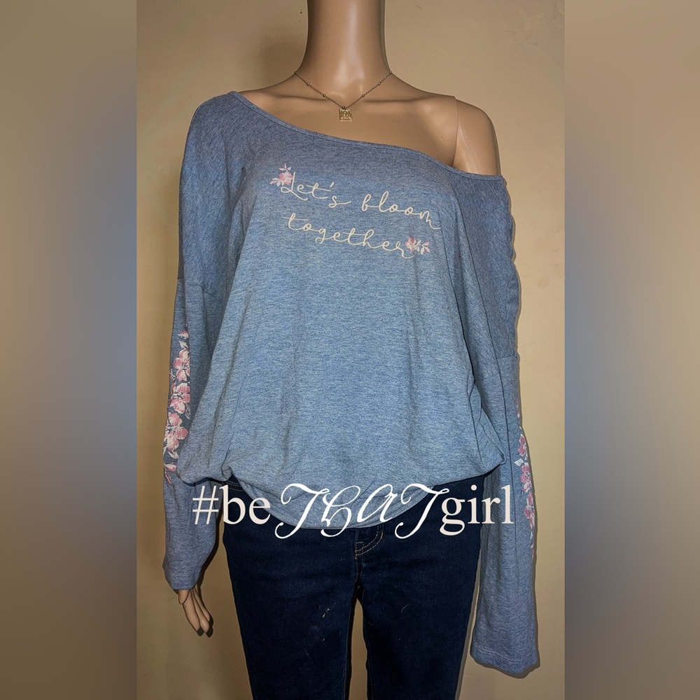 Blue off the shoulder top with "Let's bloom together" design